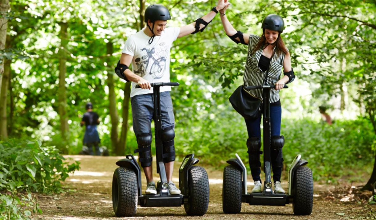 2 people riding segways