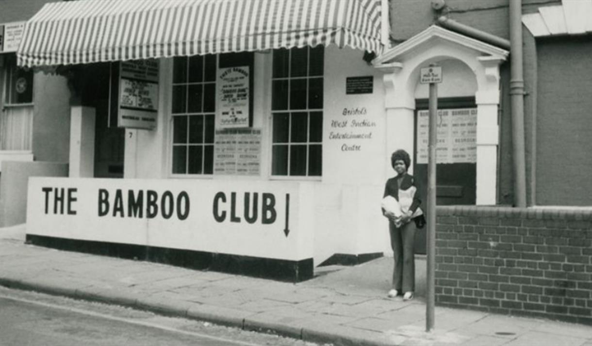A black and white image of a shop with The Bamboo Club written on the front