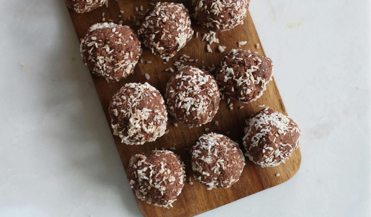 Chocolate truffles on a wooden board