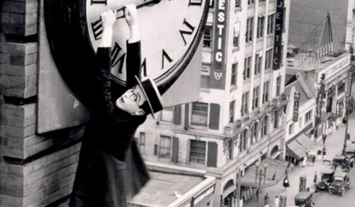 Harold Lloyd hanging from a clock