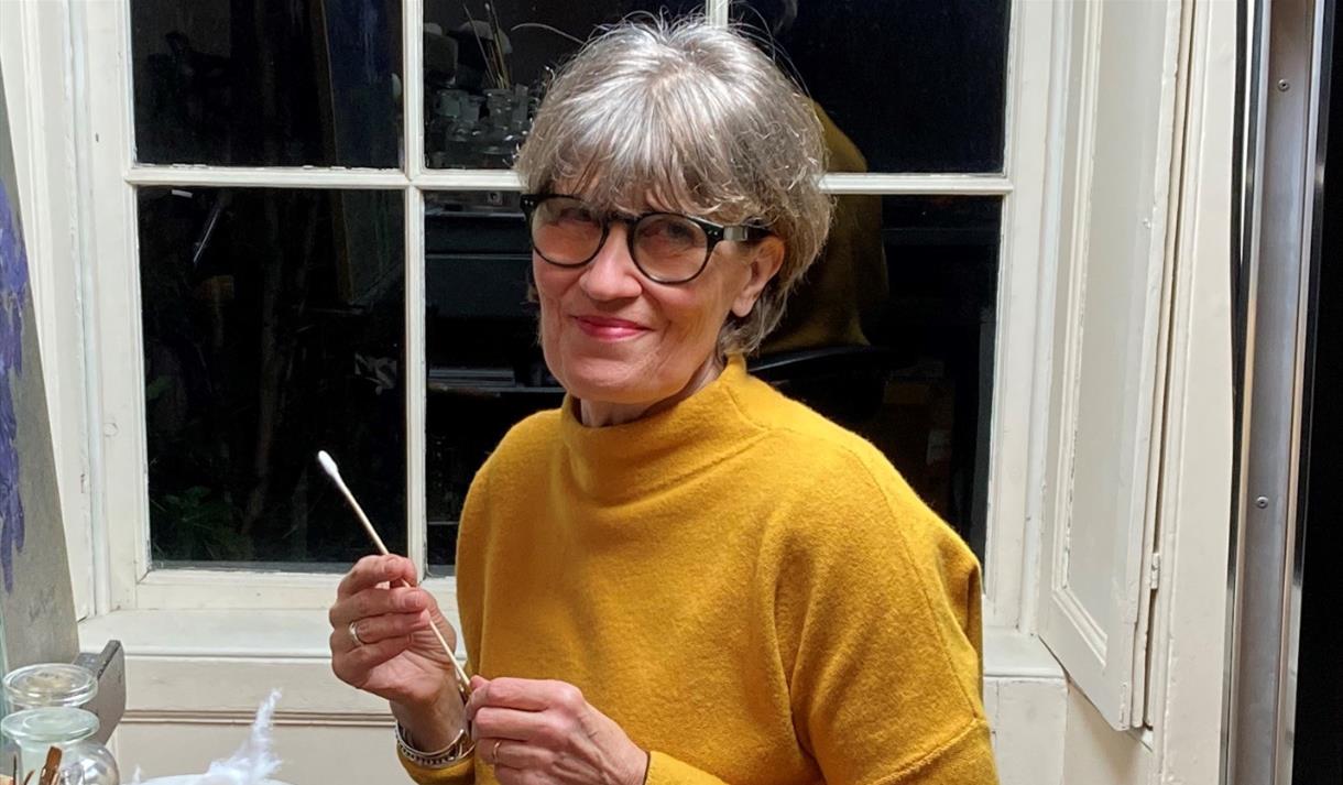 Photo of Helen Malone in a studio