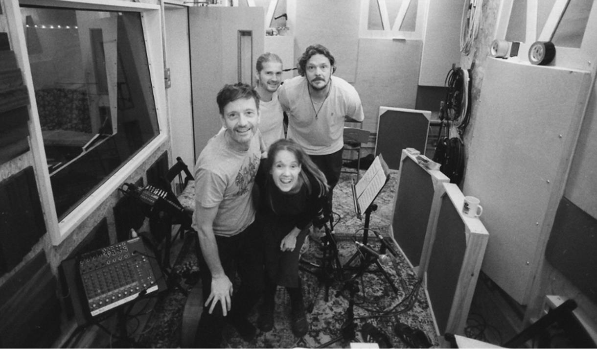 A black and white picture of the Eleven Magpies band