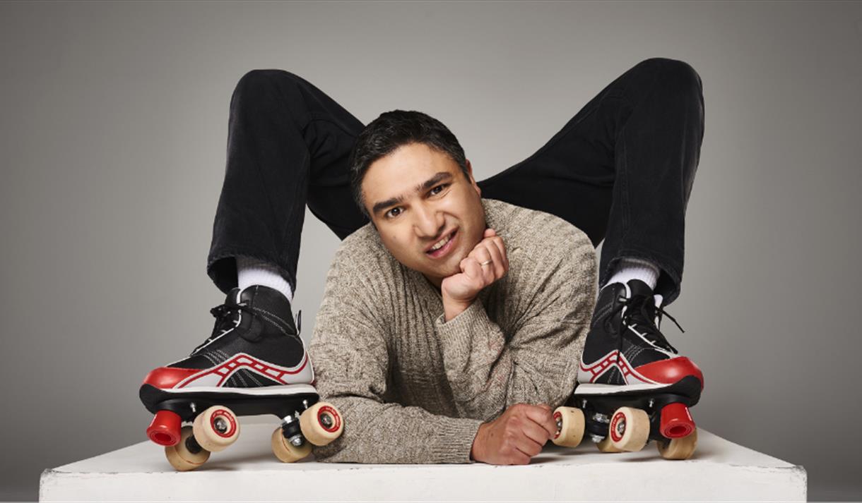 Nick Mohammed wearing roller skates