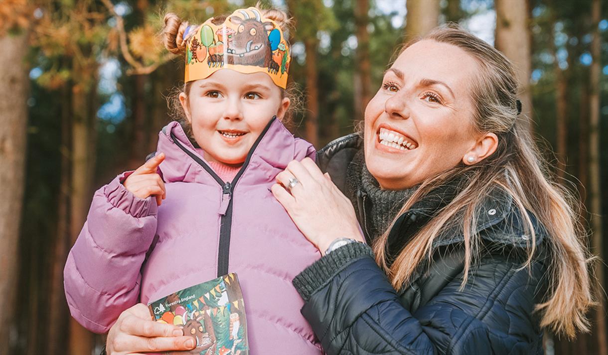 woman and young girl in woodland