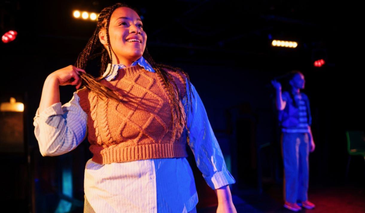 Woman smiling on stage
