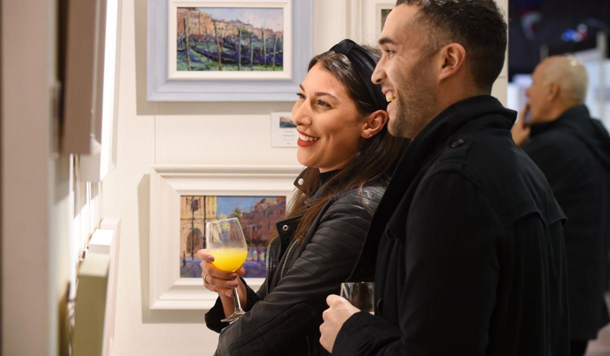 Visitors appreciating the art at Contemporary Art Fairs Windsor