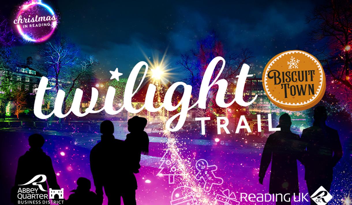 People looking at and walking amongst colourful lights