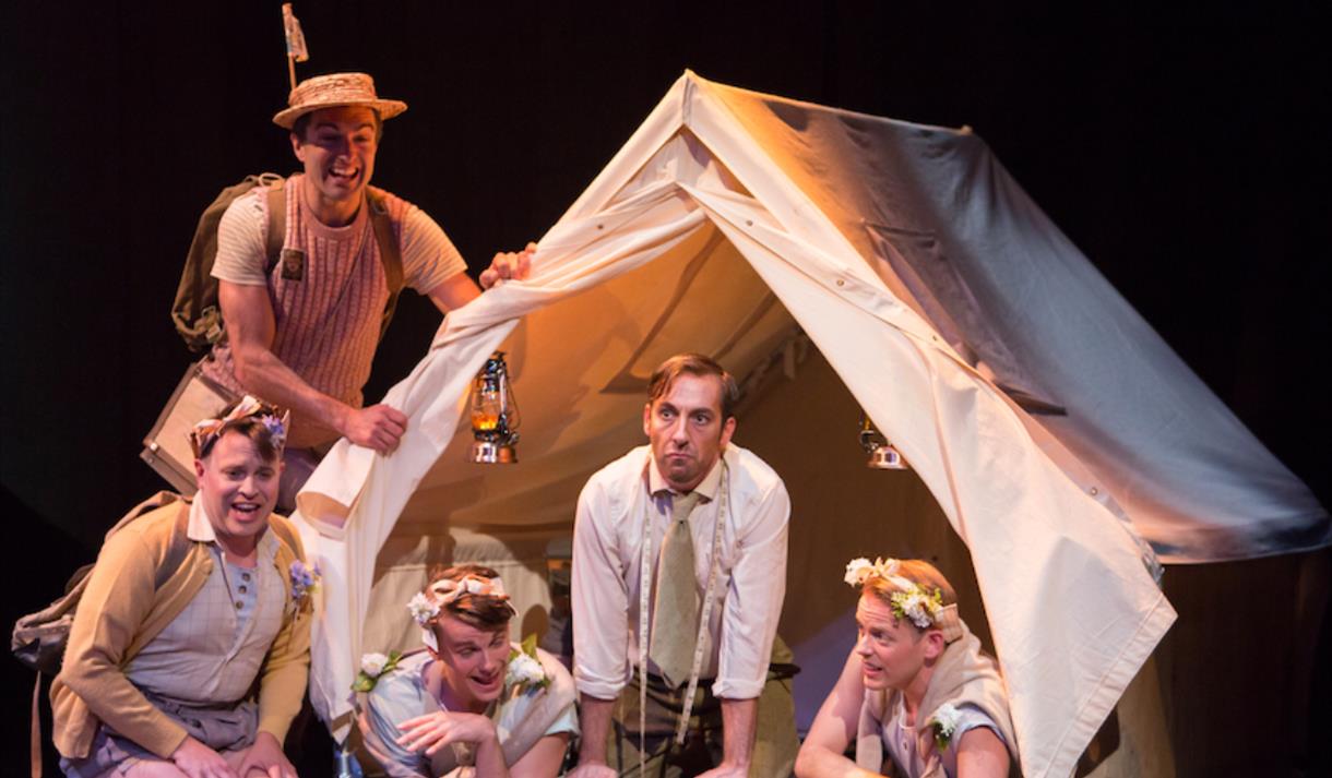 Five men in a tent