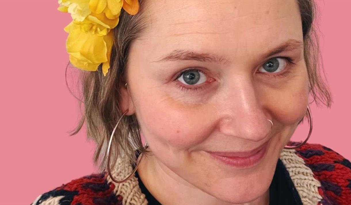 A lady wearing a flower headdress