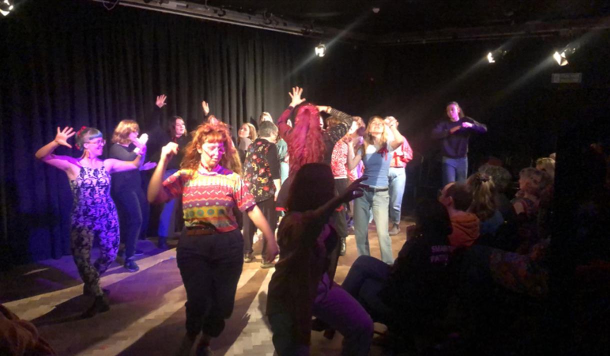 Women performing on stage at Bristol Improv Theatre