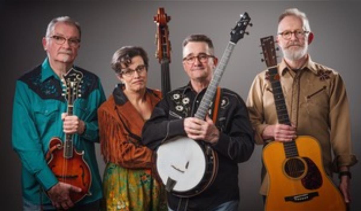 4 musicians holding instruments