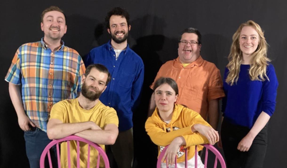 The cast members of GÄMEZ smiling.