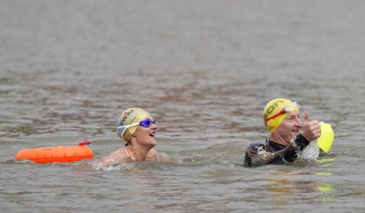 2 people swimming in Bristol Harbour