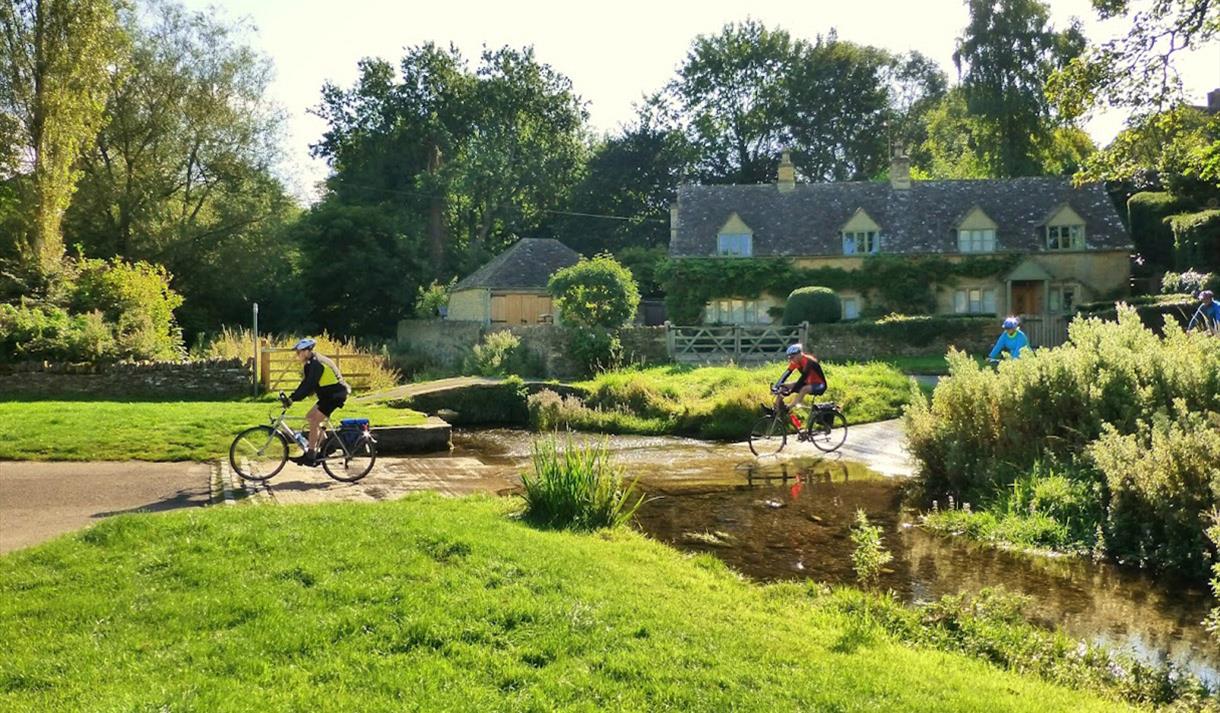 Bainton Bikes - cyclists crossing the Slaughters ford