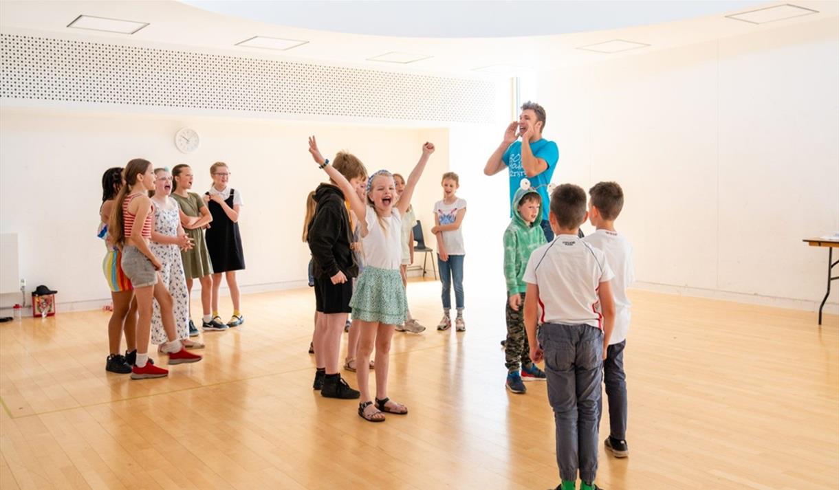 A group of children in a hall