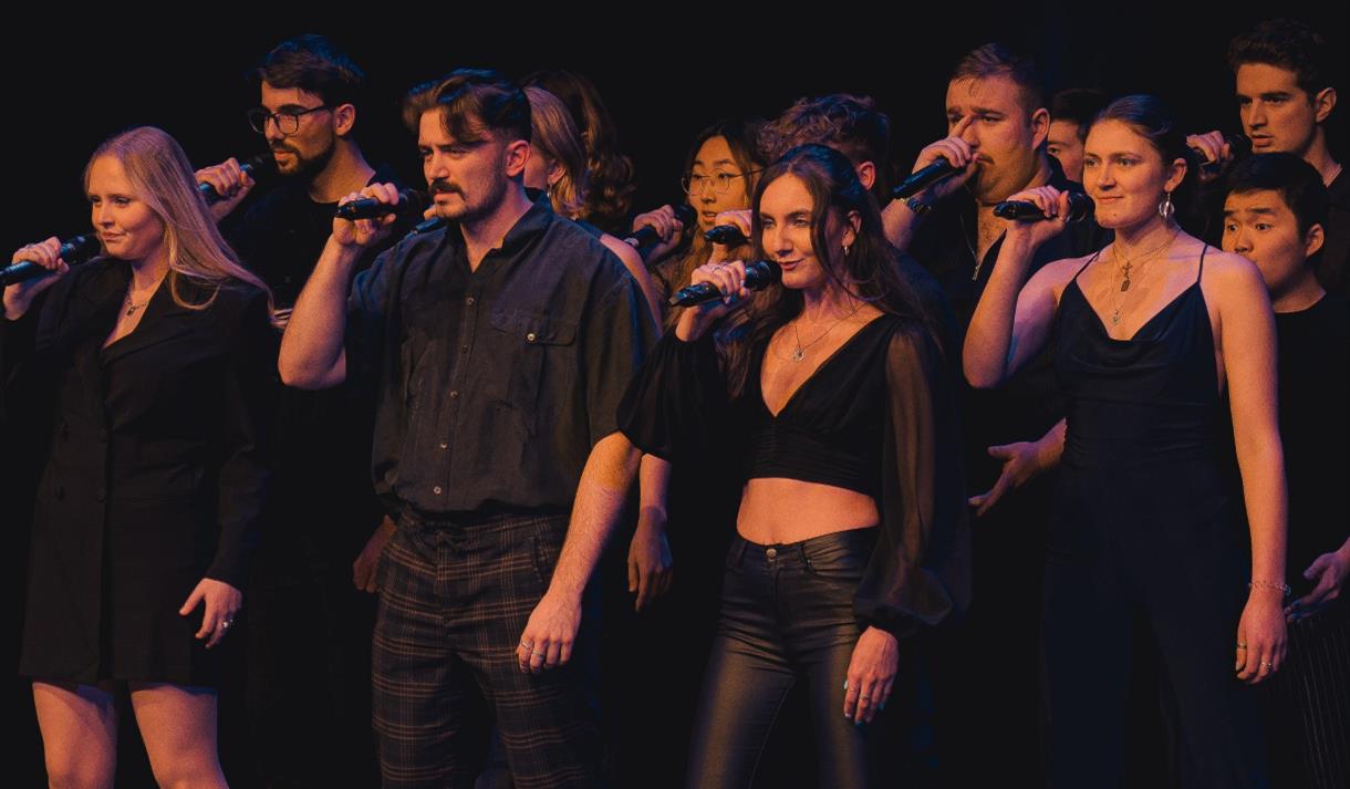 A choir performing on stage