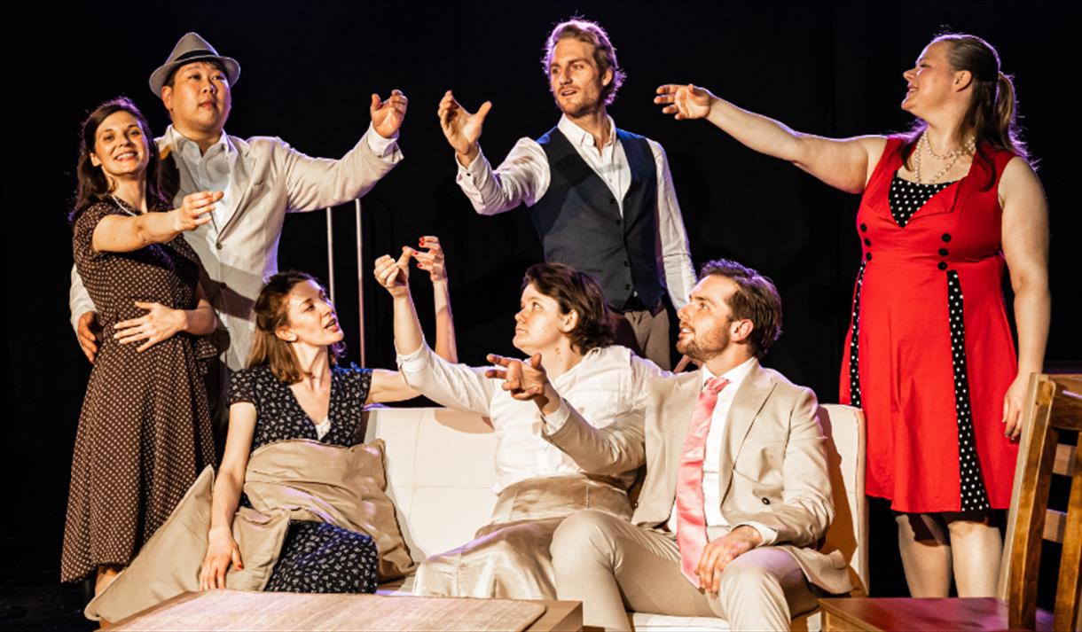A group of actors performing on stage