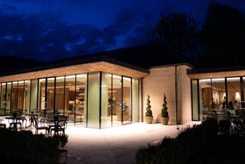 Exterior of the Walled Garden Restaurant at Lucknam Park by night