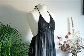 A black macrame dress on a mannequin