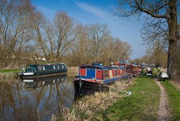 canal boats moored up on the edge of the canal