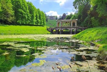 A view over the middle lake towards the Palladian Bridge on a sunny spring day.