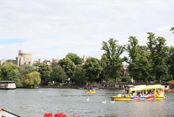 Windsor Duck Tours on River Thames with Windsor Castle in distance