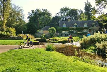 Bainton Bikes - cyclists crossing the Slaughters ford