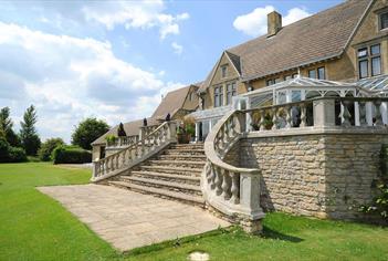 Cricklade House Hotel garden and stone steps to outside patio