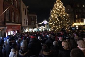 Carols on the Hill - crowd singing around the Christmas tree and with military band, Christmas lights in background