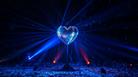 Glitterball heart illuminated by light beams