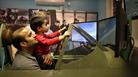 Maidenhead Heritage Centre: man and boy enjoying the Spitfire Simulator