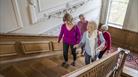 Visitors walking up staircase