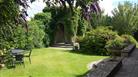 Cricklade House Hotel back garden and seating area