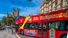 Red open-top tour bus in Bath