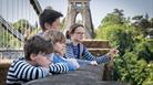 Family looking over bridge