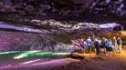 Visitors walking through one of the show caves at Wookey Hole Caves