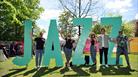 Guests stood with JAZZ sign.