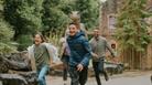 A family running through the Dinosaur Valley area at Wookey Hole Caves