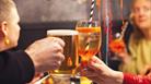 2 people cheersing their drinks