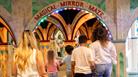 Two families walking into the Mirror Maze at Wookey Hole Caves