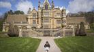 Girl playing in the garden at Easter at Tyntesfield, North Somerset by Rob Stothard