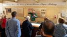 One of the guides at Wookey Hole demonstrating how paper was made on the site to visitors