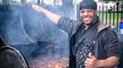 Man cooking jerk chicken at St Pauls Carnival
