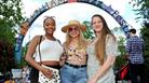 Ladies stood in front of the Jazz Festival sign.