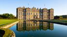 view of Longleat House, with reflection in fountain