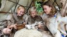 children holding animal skull