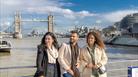 Three people on the top of City Cruisers boat with Tower Bridge in the background