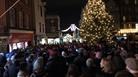 Carols on the Hill - crowd singing around the Christmas tree and with military band, Christmas lights in background