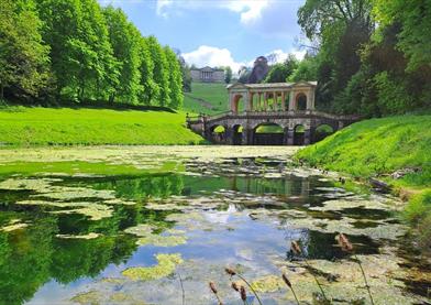 A view over the middle lake towards the Palladian Bridge on a sunny spring day.