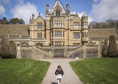 Girl playing in the garden at Easter at Tyntesfield, North Somerset by Rob Stothard